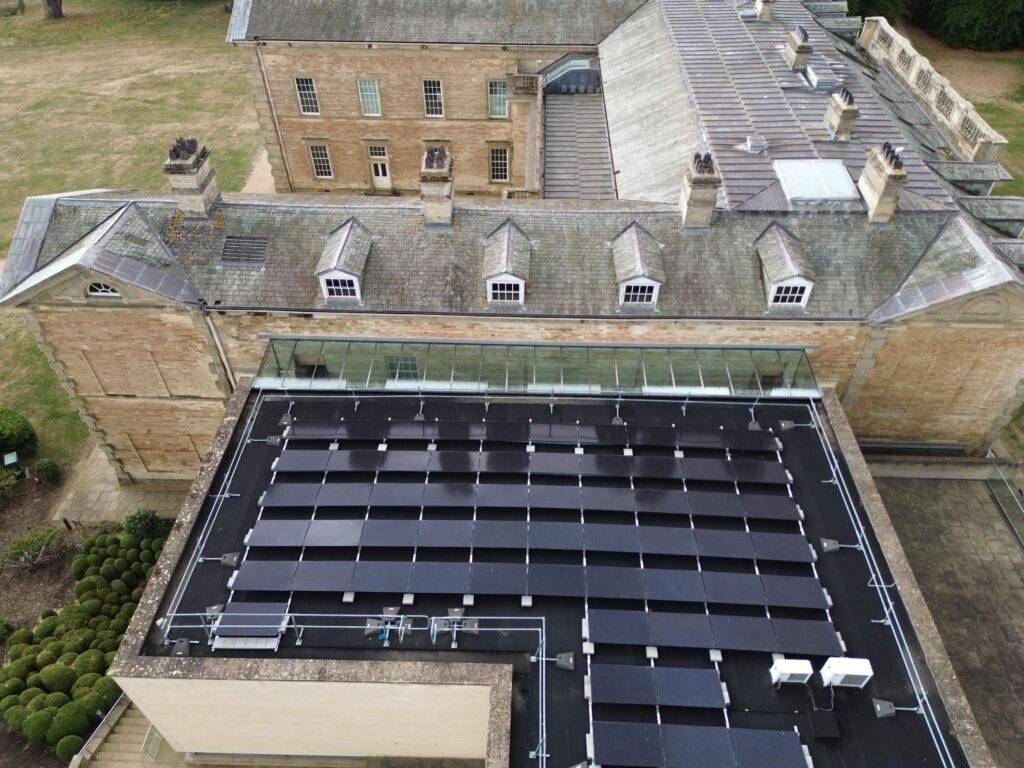 Solar panel installation on the roof of a large building