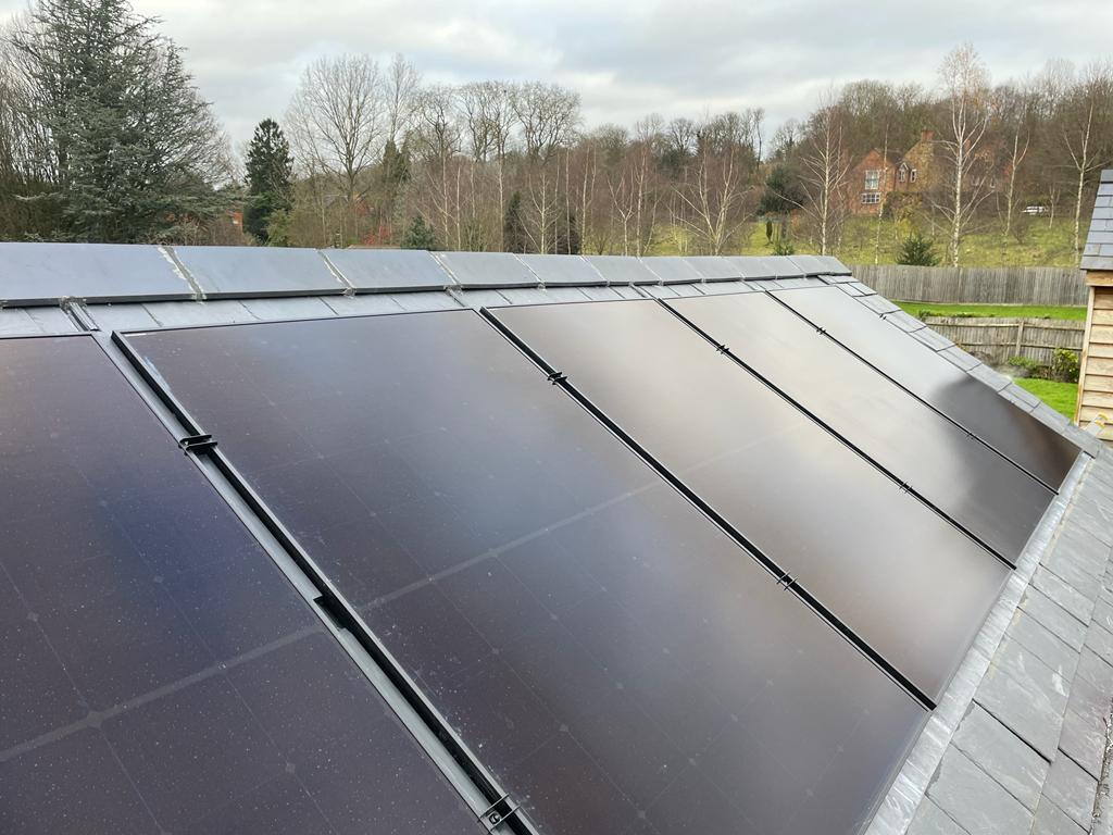 Solar panels on the roof of a detached house in Warwickshire