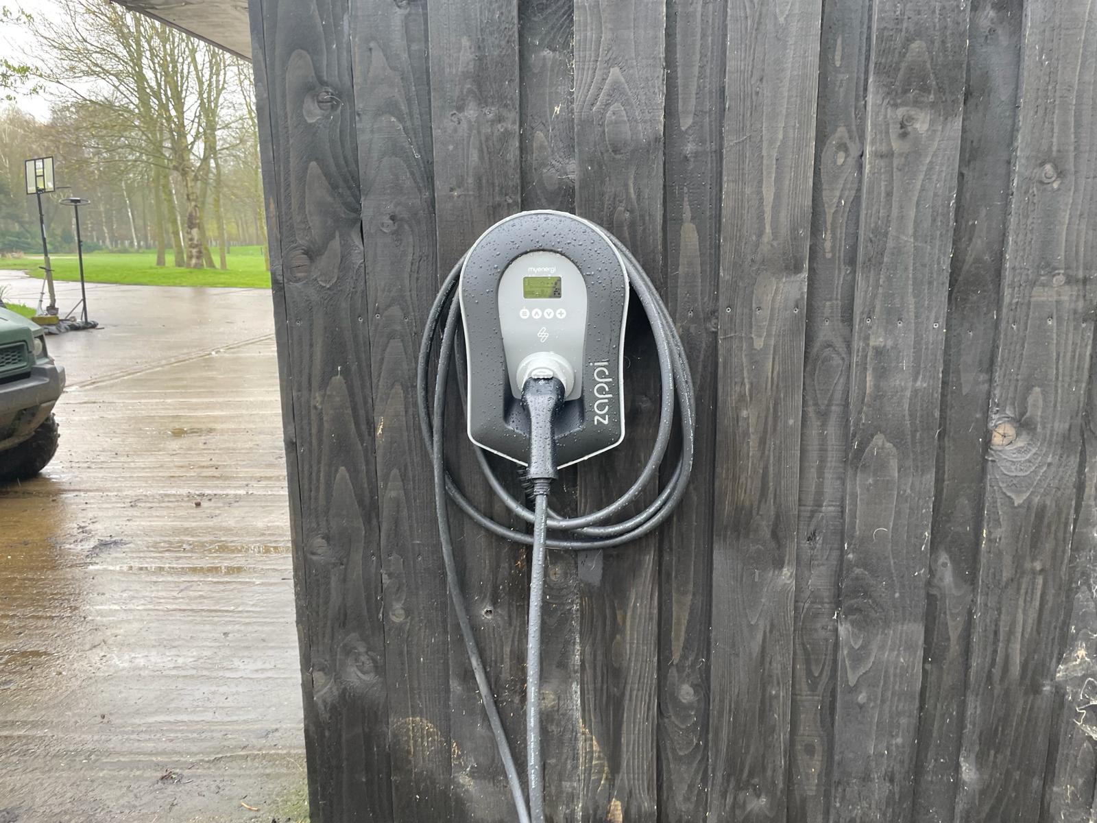 Close up of a Zappi EV charger installed in a Warwickshire Farm