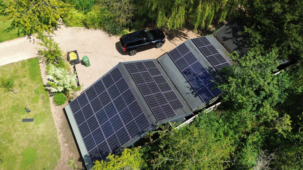 Drone shot of a solar PV installation on the roof of an outbuilding in Warwickshire